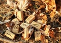 View of the Runic alphabet which lies on yellow foliage and dry grass near a dry broken hemp. Set for a magic ritual. Blur effect