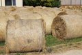 Hay bales are stacked in large stacks on an unknown riding centre Royalty Free Stock Photo