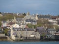 View of a rural city situated in the Shetlands islands of Scotland, nestled near a body of water