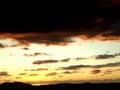 View of a rural landscape of the Albanian countryside against a beautifully nuanced ablaze sky during dusk