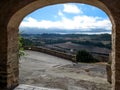 View of a rural landscape through the arched passage of Montfalco Murallat  fortified village in Catalonia Lleida, Spain. Royalty Free Stock Photo