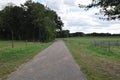 Landscape with rural sealed road on the rim of a typical Dutch streamvalley Royalty Free Stock Photo