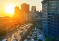 Rush hour traffic on the Brooklyn Queens Expressway in New York City with sunset background Royalty Free Stock Photo