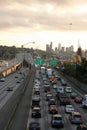 Rush hour traffic on freeway Seattle skyline