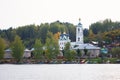 View on russian historical town Plyos on the Volga River from moving cruise ship at sunset