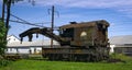 View of a Rusting of Train Steam Crane sitting on a Track Rusting Away