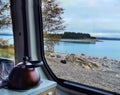 A view from rv window on a lake with blue glacier water