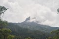 View of the sacred mountain Adam peak. Mount Sri Pada in Sri Lanka is a place of pilgrims from all over the world. Royalty Free Stock Photo