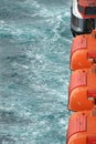 View of safety lifeboats against the background of the sea close up Royalty Free Stock Photo