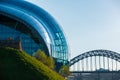 View of the Sage Gateshead and Tyne Bridge against Newcastle cityscape Royalty Free Stock Photo