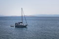 View of a sail boat, Aegean sea and landscape captured in Ayvalik area of Turkey.