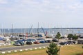 View of sailboats docked at the pier and car parking viewed from University of Kiel Sailing Center in summer Royalty Free Stock Photo