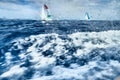 View of the Sailing regatta through a wet window of the yacht, big waves, a list of the boat, the great speed Royalty Free Stock Photo