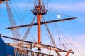 View of a sailing ship in the style of a vintage sailboat against the background of the evening sky in the port of Varna Royalty Free Stock Photo