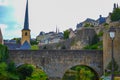 View of Saint Michael`s Church Eglise Saint-Michel in old town of Luxembourg City, Luxembourg, with an old stoned bridge and th Royalty Free Stock Photo