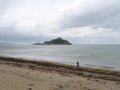 View of Saint Michael\'s Mount Cornwall England from beach with sea weeds