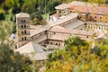 View of Saint Scholastica medieval monastery surrounded, by trees in Subiaco. Founded by Benedict of Nursia