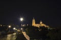 View of Salamanca Old and New Cathedrals from Roman bridge over Tormes River at night, Community of Castile and LeÃÂ³n, Spain. Royalty Free Stock Photo