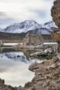 View of a Saline Soda Lake with Snow Capped Eastern Sierra Navada Mountains on a Cloudy Day in the Afternoon with Sunlight Shinnin Royalty Free Stock Photo