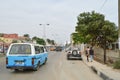 View of samba road in the city center with people, vehicles and buildings