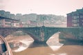 View of San Anton bridge crossing the estuary of bilbao in a foggy day