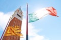 A view of the San Marco campanile and a flag