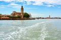 View of San Michele church building and bell tower. Cemetery in Venice, Italy, seen from the lagoon while leaving the city in a to Royalty Free Stock Photo