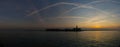 View of the San Michele island in Venice at sunset.Traces of airplanes in the sky Royalty Free Stock Photo