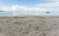 View from the sand of the Caribbean Sea with boats and a beautiful blue sky with clouds Royalty Free Stock Photo