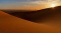 view of the sand dunes at Erg Chebbi in Morocco at sunset with a sunstar Royalty Free Stock Photo