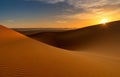 view of the sand dunes at Erg Chebbi in Morocco at sunset with a sunstar Royalty Free Stock Photo