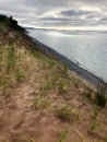 View of sand dunes from hilltop in state park in Michigan