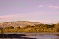 View of the Sandia Mountains and the Bosque along the Rio Grande River at sunset in Albuquerque, New Mexico Royalty Free Stock Photo