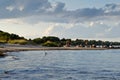 A view of sandy beach, baltic sea and old breakwater posts with