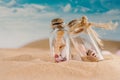 Sandy beach and shells in two glass jar on sand and summer beach Royalty Free Stock Photo