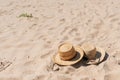 View of sandy beach with summer hats and sunglasses. Blank advertisement or packaging layout Royalty Free Stock Photo