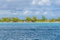 A view of sandy beaches and wind bent trees on the island of Eleuthera, Bahamas