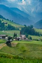 view of Santa Maddalena church in Dolomites, Italian Alps. Val Di Funes valley . Lonely church on green meadow on Royalty Free Stock Photo