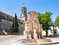 View of the Santa Maria fountain with Baeza Cathedral in Jaen, Spain, from Plaza de Santa Maria Saint Mary square