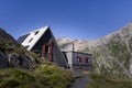 View of the Scaletta hut near the Greina Pass in Blenio, Switzerland. In the foreground is the path leading to the hut Royalty Free Stock Photo