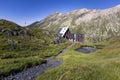 View of the Scaletta hut near the Greina Pass in Blenio, Switzerland. In the foreground is the path leading to the hut Royalty Free Stock Photo