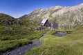 View of the Scaletta hut near the Greina Pass in Blenio, Switzerland. In the foreground is the path leading to the hut