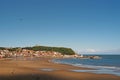 view of scarborough south bay beach with the town lighthouse harbour and on a sunlit summer day Royalty Free Stock Photo