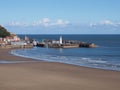 Scarborough south bay with lighthouse harbour and town on a sunlit summer day Royalty Free Stock Photo