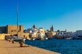 View of scenic city scape and a fishing harbor with marina in Monopoli, Italy Royalty Free Stock Photo