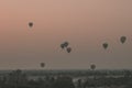 View of a scenic sunrise with many hot air balloons above Bagan in Myanmar. Bagan is an ancient city with thousands of historic Royalty Free Stock Photo