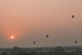 View of a scenic sunrise with many hot air balloons above Bagan in Myanmar. Bagan is an ancient city with thousands of historic Royalty Free Stock Photo