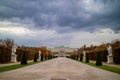 View of Schloss Belvedere Palace with walking alley and ancient statues in Vienna.