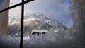 View of the Schneeberg mountain through an icy window Royalty Free Stock Photo
