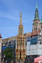 View of the `Schoner Brunnen` fountain in the historical town of Nuremberg, Germany